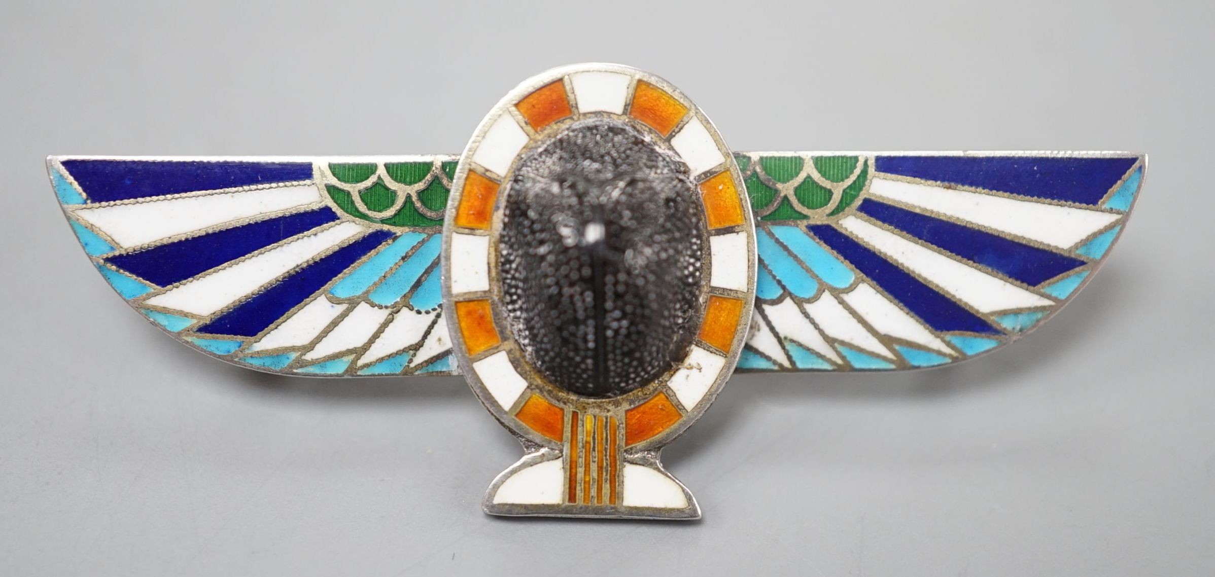 A German 800 standard white metal and 'scarab' set winged bar brooch, 48mm.